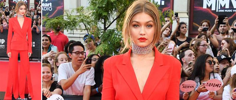 Lady in Red: Gigi Hadid makes a bold statement in red flared trouser suit at 2016 iHeartRadio Much Music Video Awards